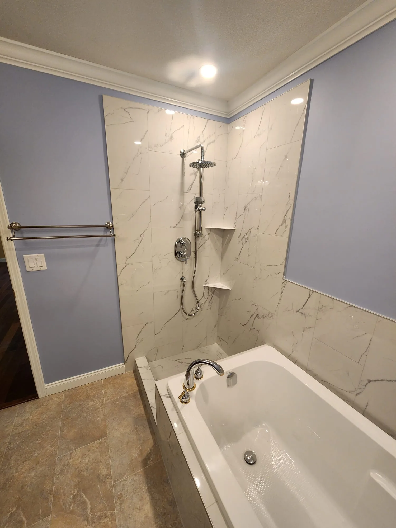 Before installation — wider view showing shower and soaker tub zone prior to glass fitting